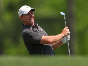 Rory McIlroy watches his shot
