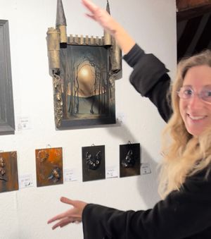 Claire Valentine-Gibson with her painting called Listen to the Moon.