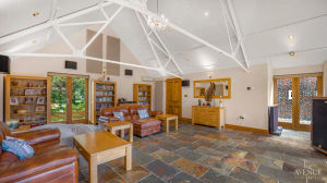 The double garage turned family room is spacious and colourful