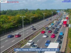 Traffic on the southbound M6 at Junction 10a (right) at about 1.30pm