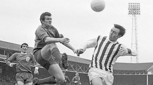 Tommy Lawrence, the Liverpool goalkeeper, is beaten to the ball by Astle