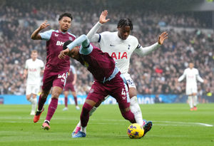 Tottenham Hotspur's Destiny Udogie fouls Aston Villa's Ezri Konsa 
