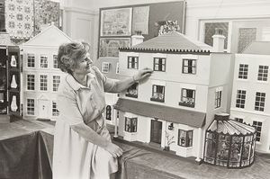 Wolverhampton College of Adult Education was showing an exhibition of work, including a display of dolls' houses made at classes in Smestow School. The photograph shows Joyce Wootton of The Greenway, Pattingham, with her house in September 1983.