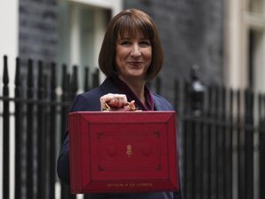 Chancellor Rachel Reeves leaves Downing Street with her ministerial red box before delivering her first Budget in the House of Commons