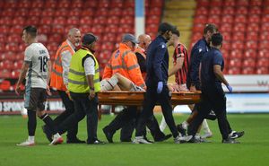 Mason Hancock was stretchered off for Walsall.