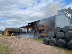 Supporting image for story: Hay bales ablaze as fire crews battle county's latest barn fire