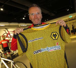 Geoff Thomas with an example of the shirt that will be produced for Carl Ikeme and Cure Leukaemia
