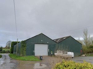One of the agricultural buildings at Top Farm in Woolston near Oswestry, has reportedly housed a squash court, bar and changing rooms since 2011. Photo: Google