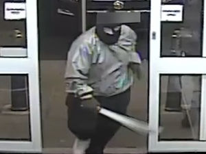 Supporting image for story: Violent armed gang caught on camera smashing through Dudley shops wielding machetes and hammers