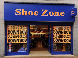 Retailer Shoe Zone revealed it has shut stores in response to soaring wage costs following the recent Budget measures as it warned over profits once again.