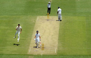 Australia's Mitchell Johnson (left) celebrates taking the wicket of England's Jonathan Trott (centre)