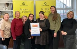 Members of the Home Instead team with their celebratory certificate