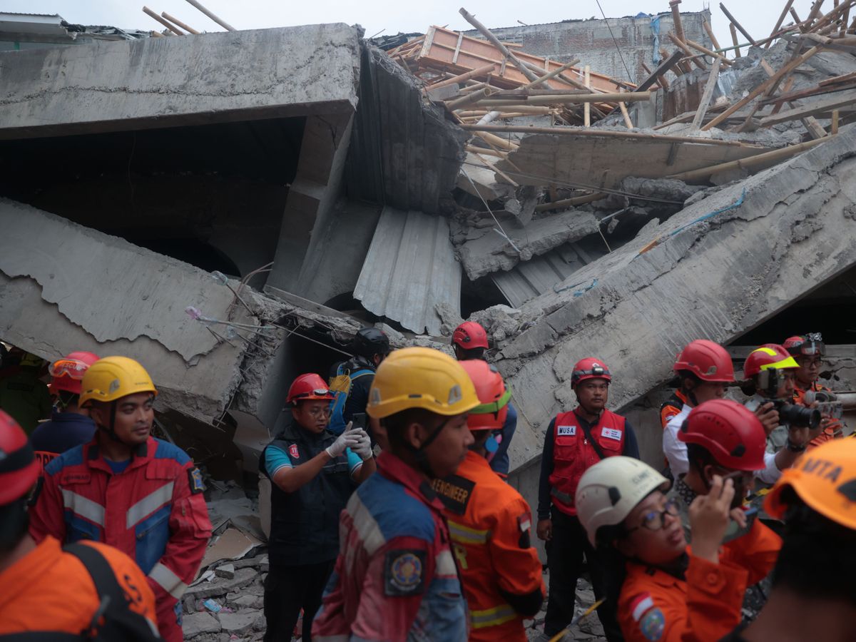 At least 91 students remain buried in rubble after Indonesia school collapse