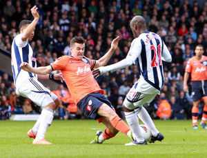 Joey Barton challenges Youssouf Mulumbu for the ball