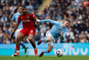 Wolverhampton Wanderers' Mario Lemina (left) and Manchester City's Phil Foden battle for the ball