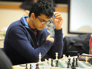 Supporting image for story: Athar Ansari on top of the rock as he doubles up in chess tournament