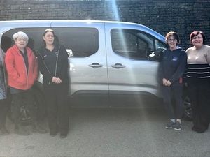 Kim Coles secretarial assistant, Sharon Francis home support officer, Sharon Owen home support senior officer, Caroline Williams home support and Beverley Baynham chief officer with the new electric car.