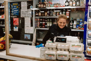 Becky Tuner behind serving screens in Turners Top Shop, Bridgnorth