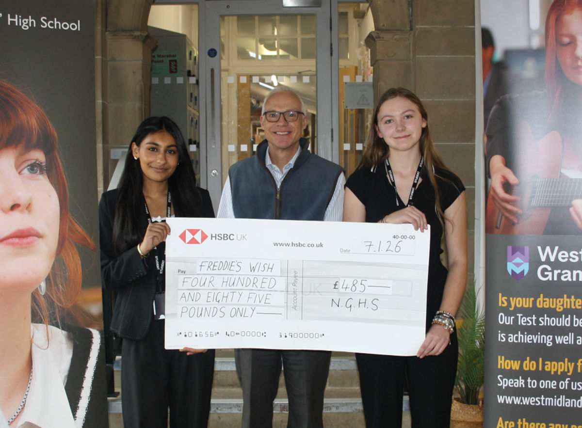 Newport pupils present generous donation to child bereavement charity after successful student-led fair