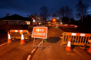 The road has been dug up for repairs to the burst pipe