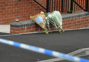Flowers left at the scene in West Road, Great Barr