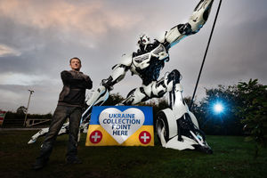 Artist Luke Kite with his robot sculpture at the British Ironwork Centre 