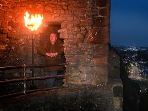 Supporting image for story: Beacon burns bright outside castle as part of D-Day commemorations