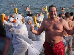 Supporting image for story: In Pictures: Cold water courage to start the new year as swimmers dive into 2026
