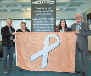 The White Ribbon accreditation and flag; from left, Councillors Julian Dean, Lezley Picton, Julia Buckley and Roger Evans