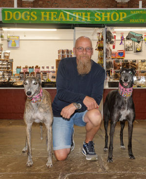 Nigel Paskin with his dogs (left) April, and (right) Selma, at Newport Indoor Market