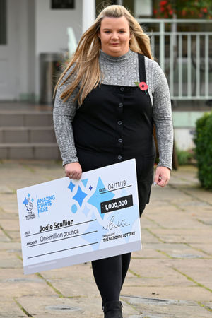 Jodie Scullion, 22, from Birmingham, celebrating her £1 million win