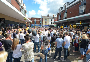 People attend a vigil for Ryan Passey earlier this month