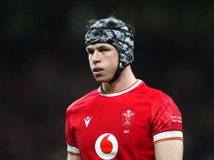 Wales’ Tom Rogers wears a headguard