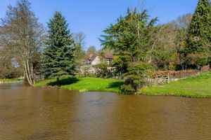 Bache Cottage enjoys views overlooking a private lake. Picture: Miller Evans/Rightmove.