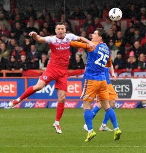Josh Ruffels battles with former Shrewsbury Town favourite Shaun Whalley for the ball. Picture: Tim Thursfield 