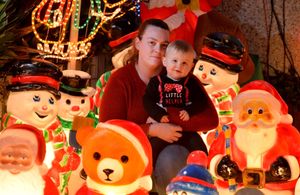 Mariesa and Taylan enjoy the lit up Santas and snowmen