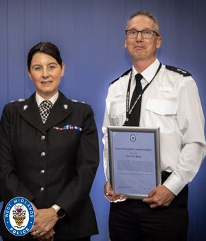 AWARD: Chief Superintendent Kim Madill with Inspector Phil Baugh