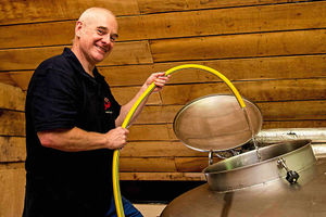 Head brewer Mark Leedham pre-rinses the fermenter