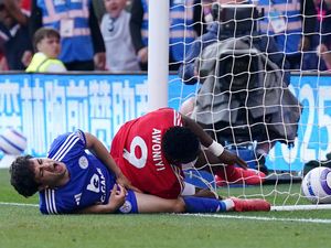 Taiwo Awoniyi, right, collides with the post