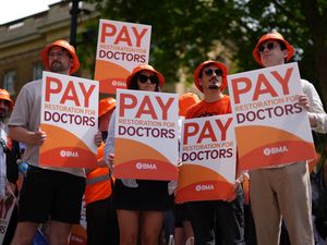Doctors protesting outside Downing Street (PA)