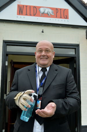 Neil Matthews from N&S Security gets ready to welcome drinkers