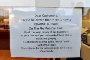 One neighbouring business has put up a sign to warn customers of the charges