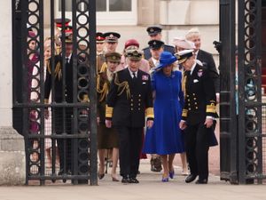 The King and Queen arrive for the military procession