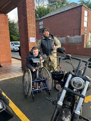 One of the Hells Angels with a pupil from Penn Hall School
