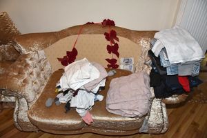 Cash  discovered at the back of a sofa during a search of a property in Sutton Road. Photo: NCA/PA Wire