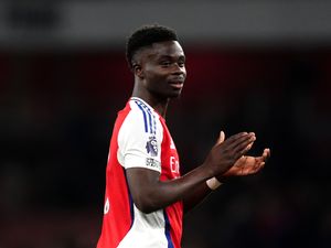 Bukayo Saka applauds supporters