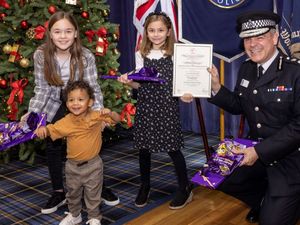 Supporting image for story: Children of popular police officer collect award after her death aged 34