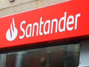 Supporting image for story: Santander warns of cost-cutting action as profits plunge 44%