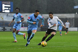 Ricardo Dinanga (AFC Telford United Midfielder)  pressures Mickleover’s defender Jake Bennett on the edge of the box (pic Kieren Griffin)