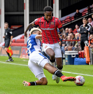 SPORT COPYRIGHT NATIONAL WORLD TIM THURSFIELD 28/09/24 .WALSALL V COLCHESTER UNITED.Liam Gordon is brought down by Lyle Taylor.